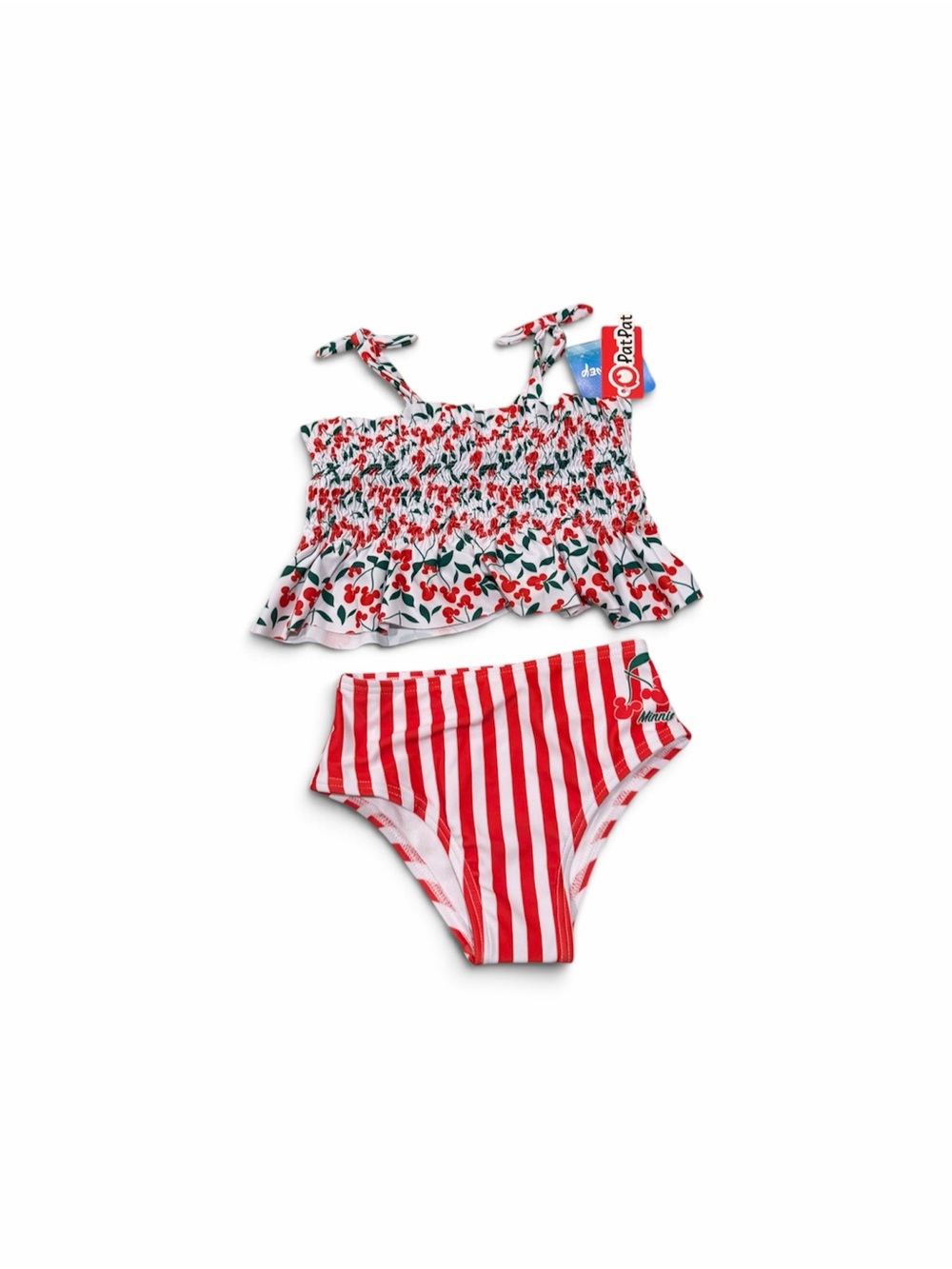 Two-piece girls swim set with cherry print smocked tank and tie straps.